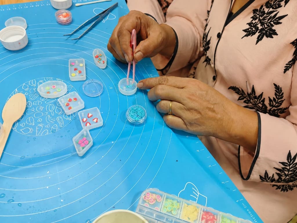 Founder hand-making intricate ornaments